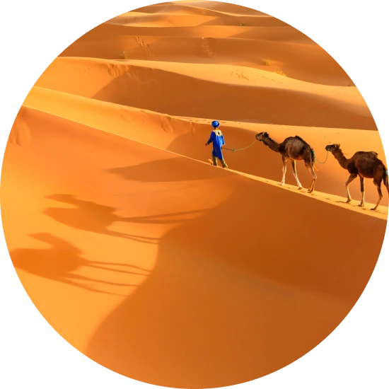 Women carry laundry in the Sahara, home to the Tuareg. 