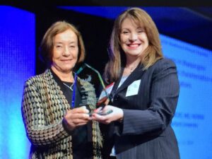Uta Francke, (left) accepts AMP Award for Excellence. Photo: Eddie Arrossi Photograghy
