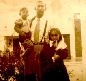 Jimmy with his father and his half sister Alina before he was taken to Brazil.